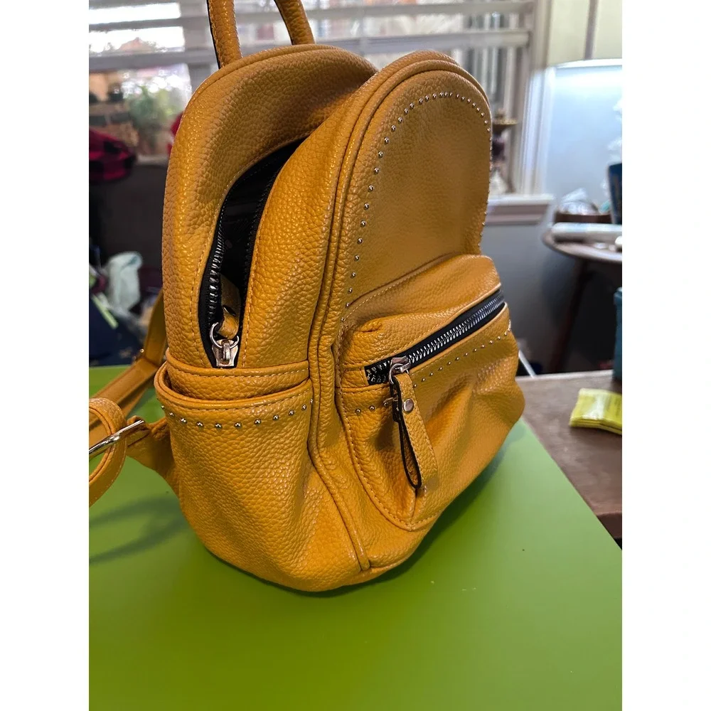 Yellow Faux Leather Studded Mini‎ Backpack Women two small worn places on bottom
